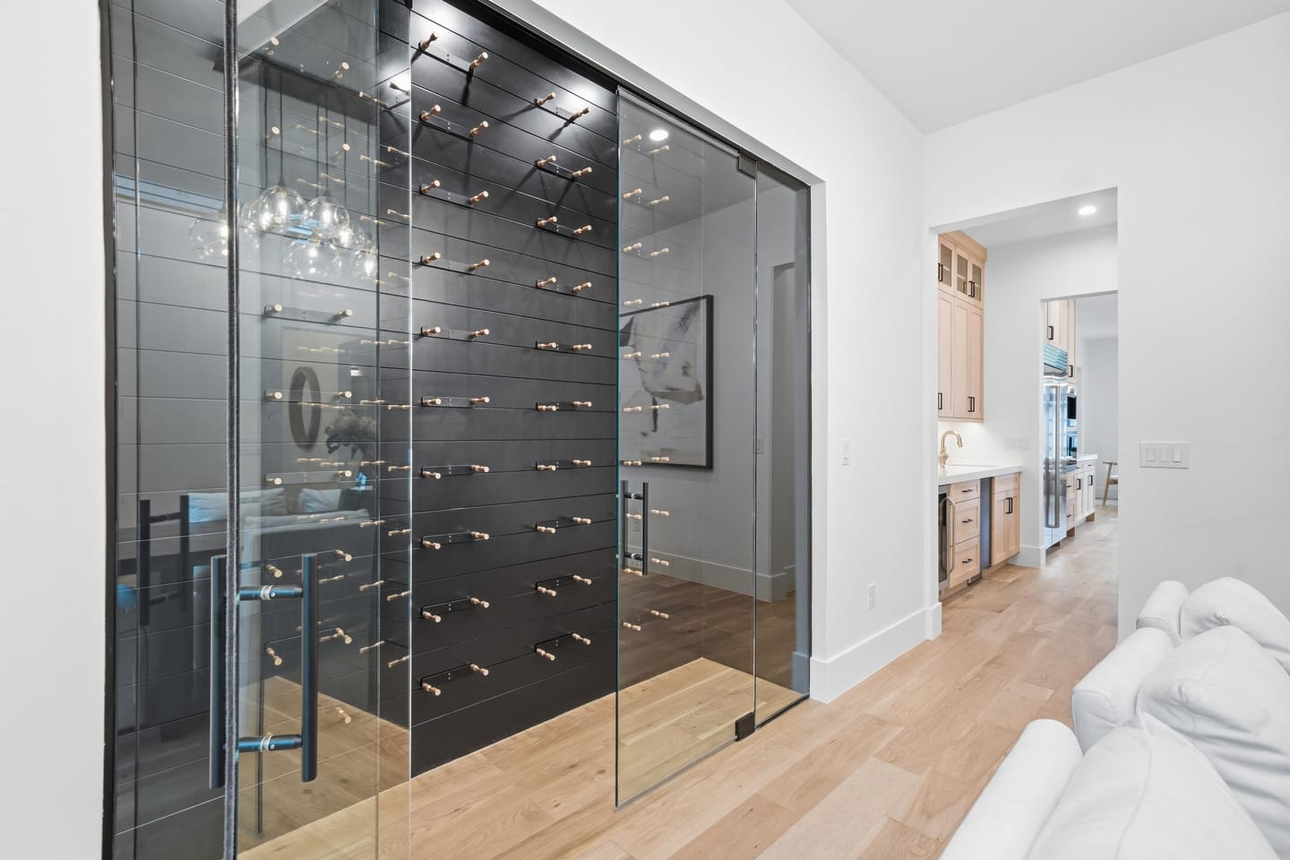 Glass-enclosed wine room adjoining the dining room