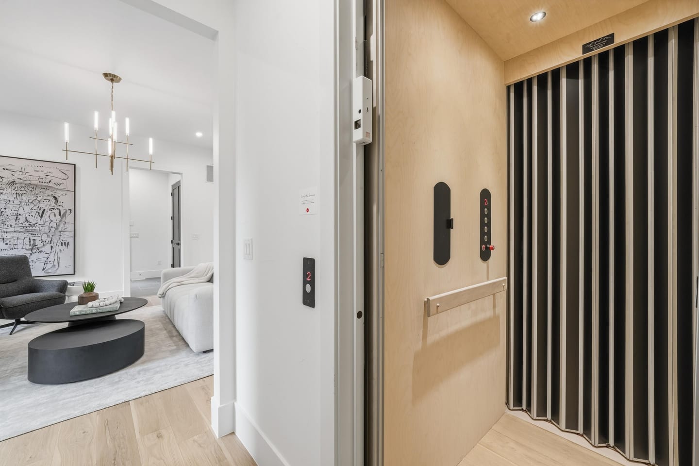 Private elevator with dark slat surround serving all levels