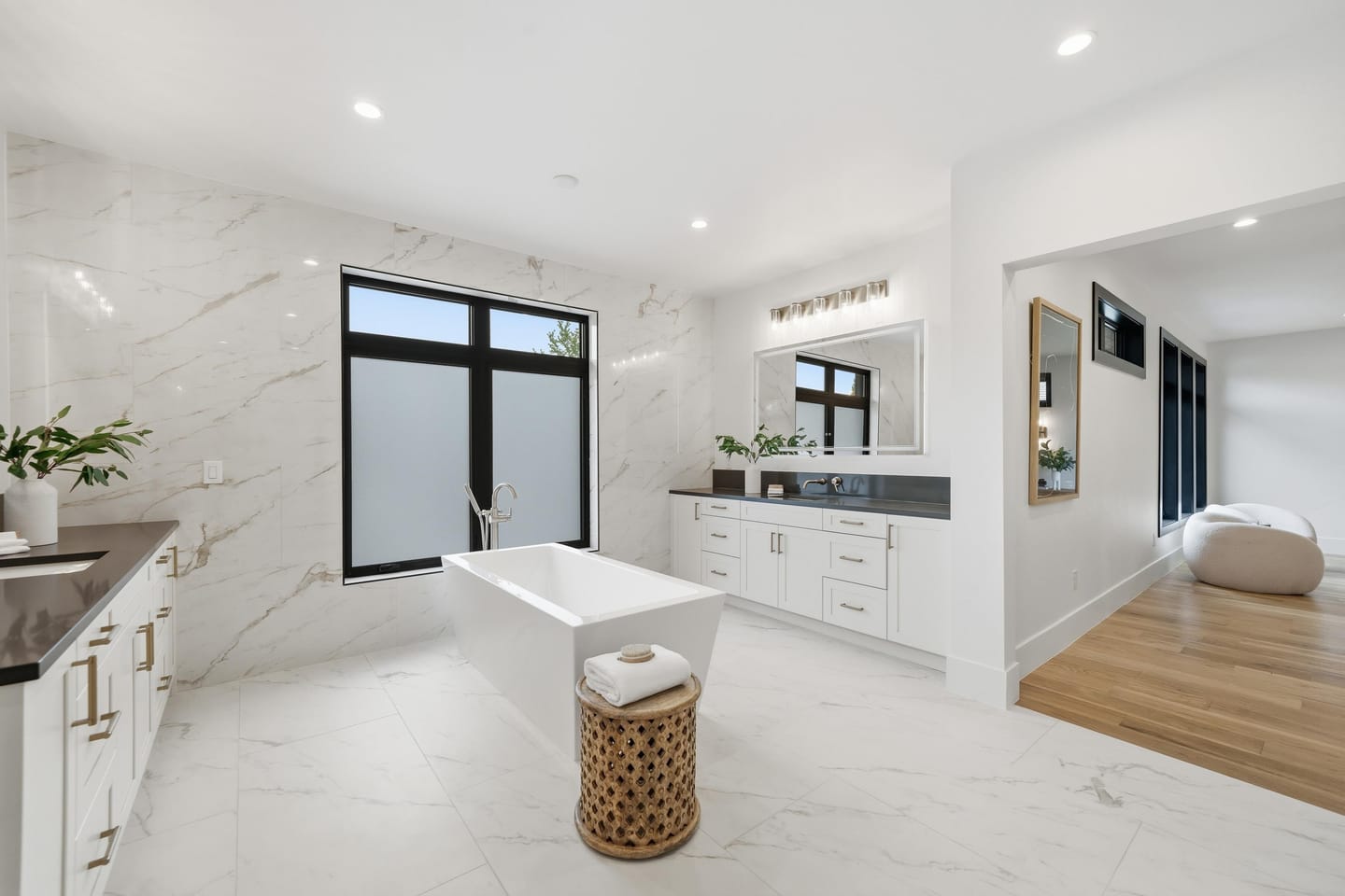 Primary bath with freestanding tub and large-format porcelain