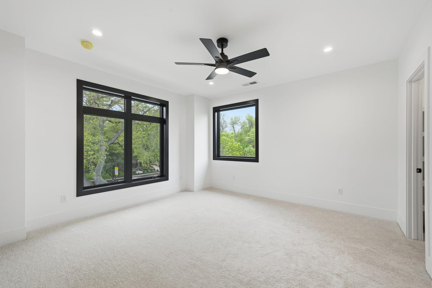 Secondary bedroom with panel-detail accent wall
