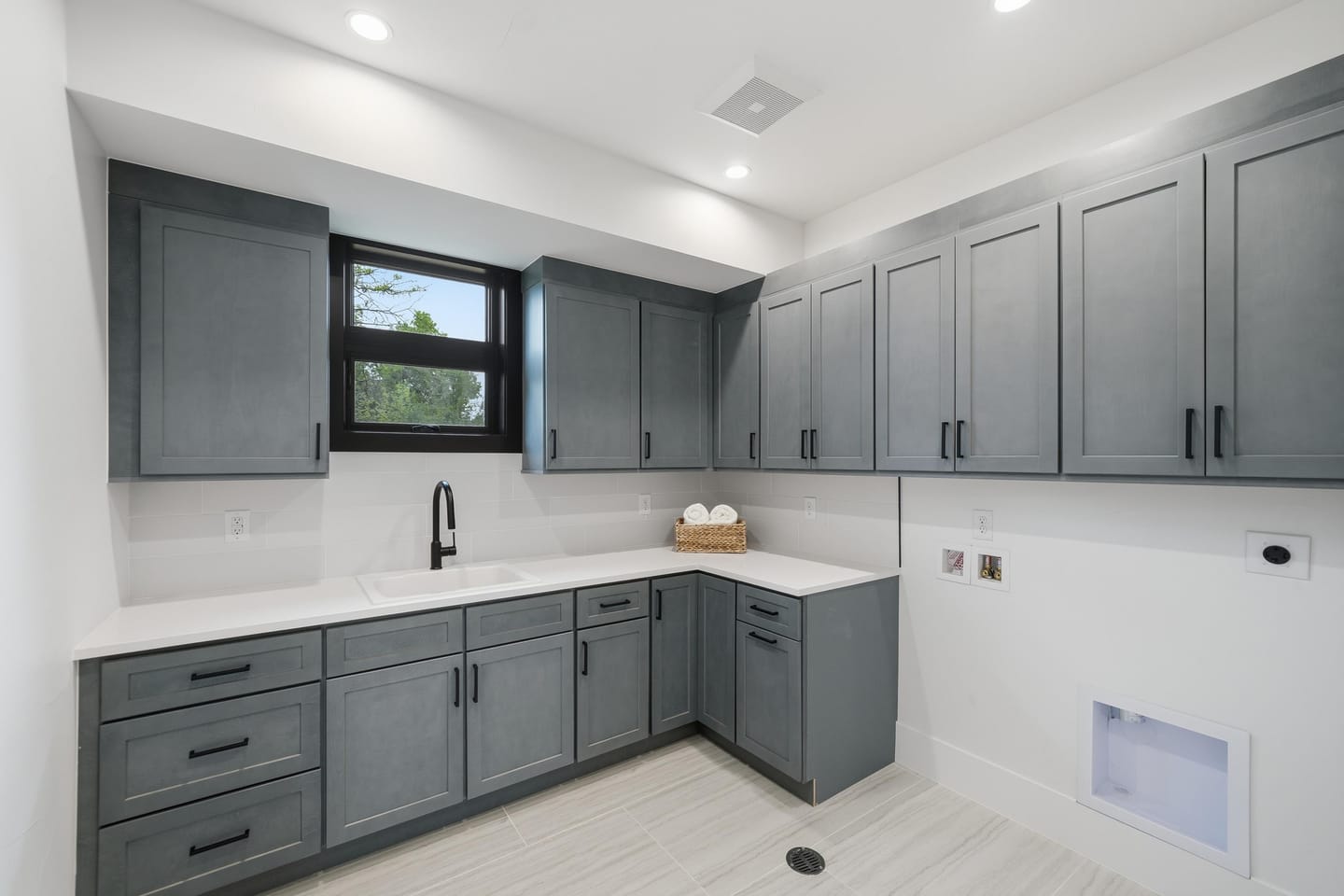 Laundry room with cabinetry and utility sink
