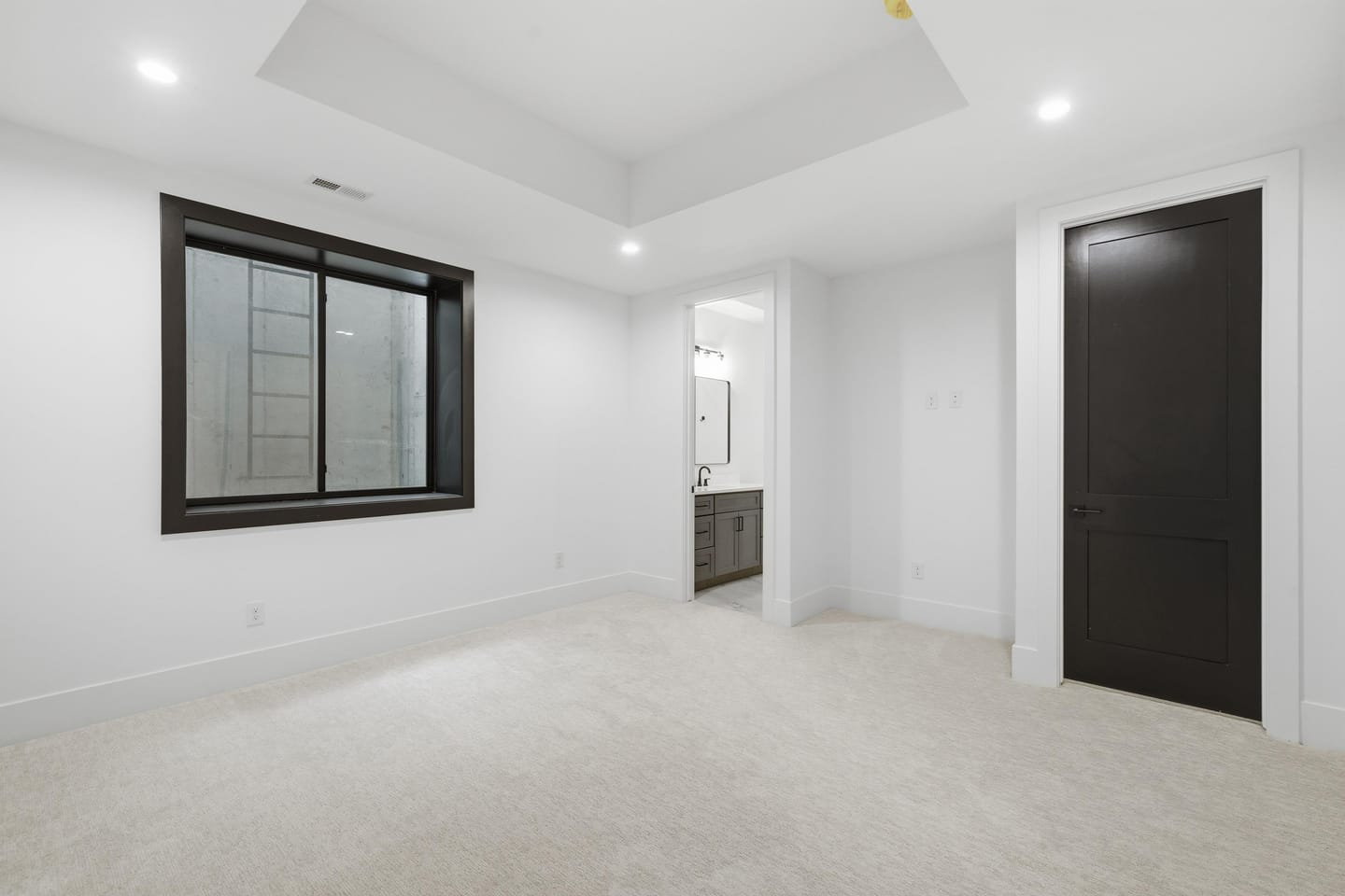 Lower-level bedroom with egress window